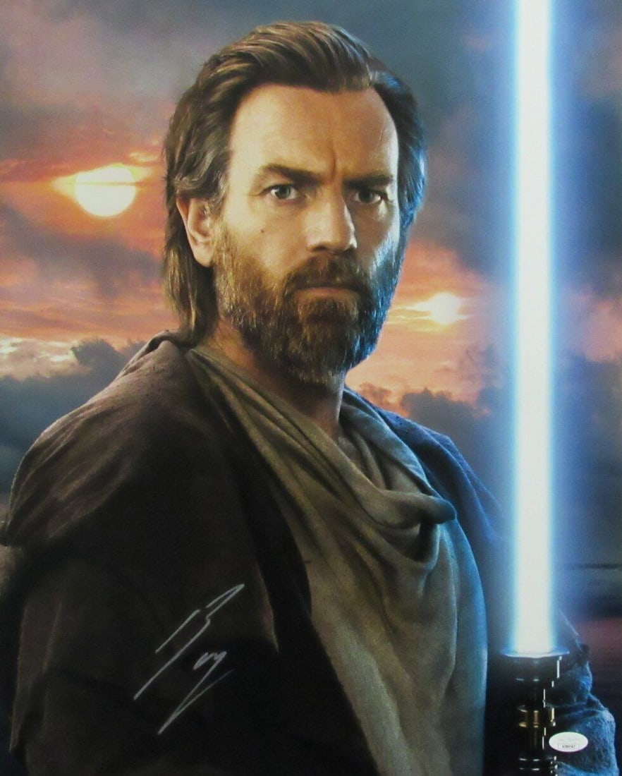 Ewan McGregor Signed 16x20 Obi-Wan Kenobi Photo JSA Authenticated: Ewan McGregor Signed 16x20 Obi-Wan Kenobi Photo JSA Authenticated Capture a piece of cinematic history with this Ewan McGregor autographed 16x20 photo featuring his iconic role as Obi-Wan Kenobi. This