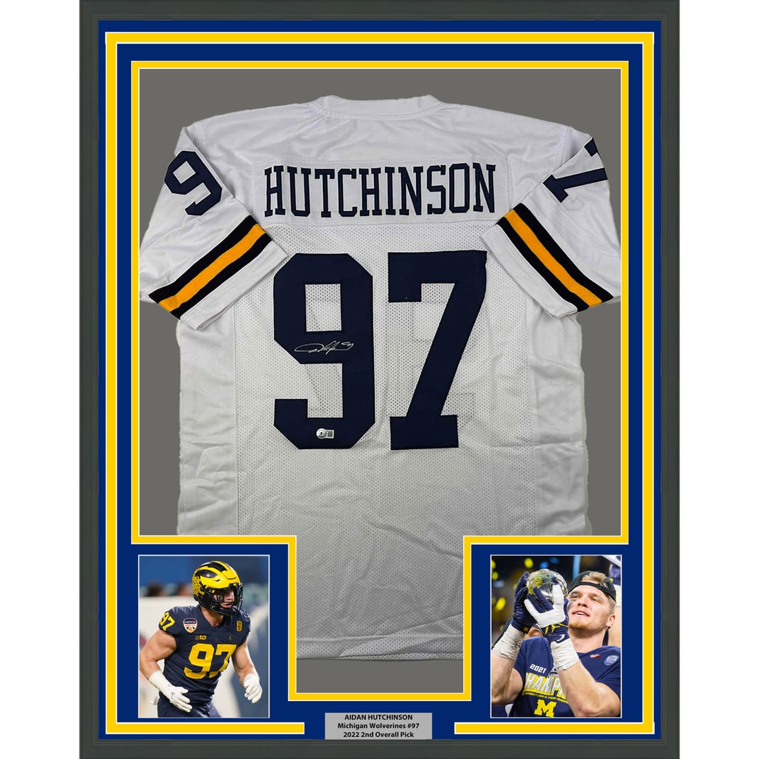 Aidan Hutchinson Signed Framed Michigan Wolverines White Jersey BAS COA: Aidan Hutchinson Signed Framed Michigan Wolverines White Jersey BAS COA Professionally framed and matted autographed Aidan Hutchinson Michigan white jersey display. This original signed piece includes