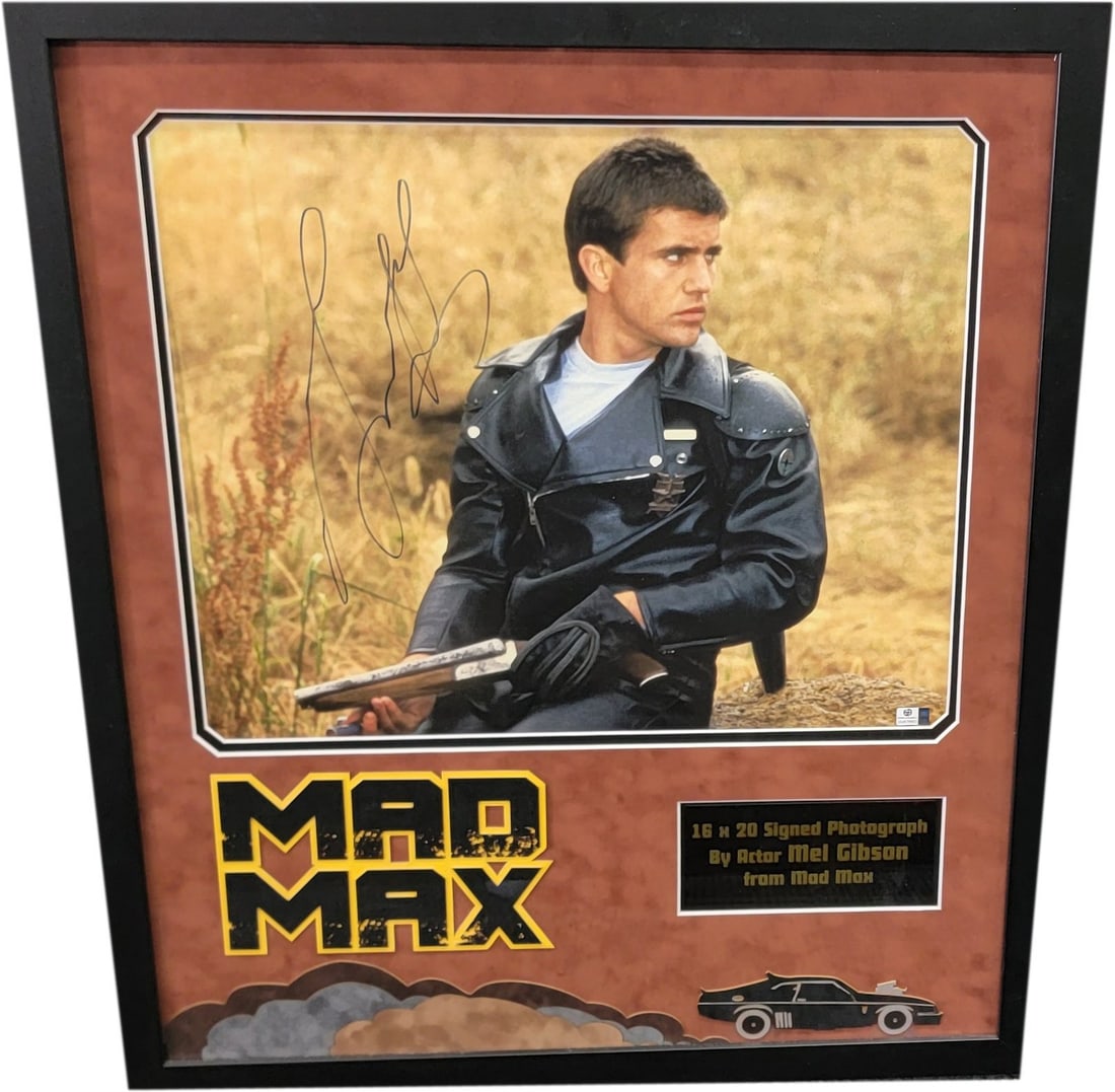 Mel Gibson Autographed 16x20 Mad Max Poster Beckett Certified: Mel Gibson Autographed 16x20 Mad Max Poster Beckett Certified This striking 16x20 poster features a hand-signed autograph by Mel Gibson, showcasing his iconic role in 'Mad Max'. The photograph is auth