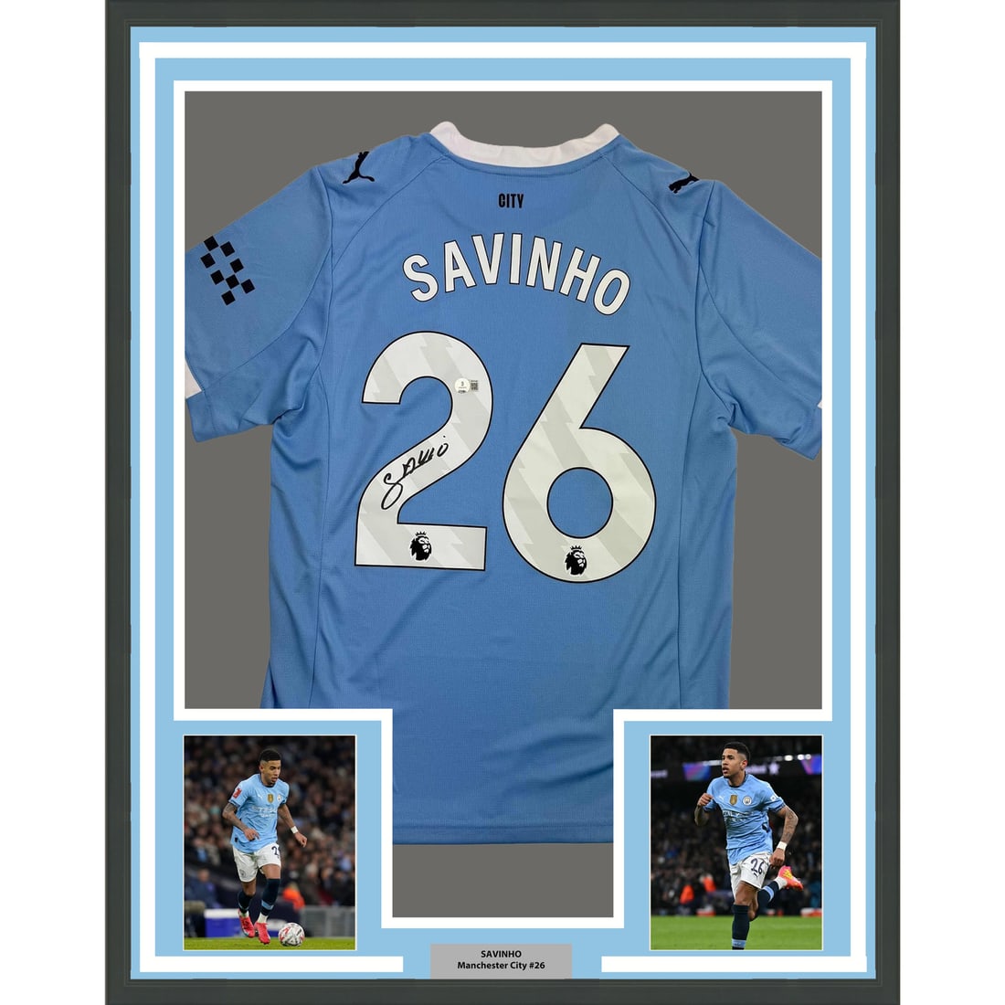 Savinho Signed Manchester City Jersey 35x39 Framed with Beckett Authentication: Savinho Signed Manchester City Jersey 35x39 Framed with Beckett Authentication This framed display features a Manchester City blue jersey autographed by Savinho. The piece is professionally framed and
