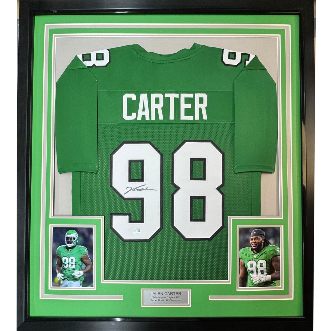 Jalen Carter signed framed football jersey 35x39 Beckett COA: Jalen Carter signed framed football jersey 35x39 Beckett COA Professionally framed and matted autographed Jalen Carter football jersey display featuring a Kelly Green jersey and two 5x7 photos. This o