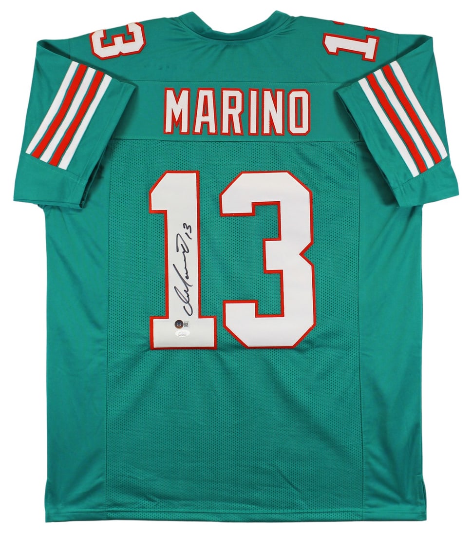 Dan Marino Signed Teal Jersey Miami Dolphins Beckett Authenticated XL: Dan Marino Signed Teal Jersey Miami Dolphins Beckett Authenticated XL This teal pro style jersey has been personally signed by Dan Marino of the Miami Dolphins. The jersey is custom-stitched, non-bran