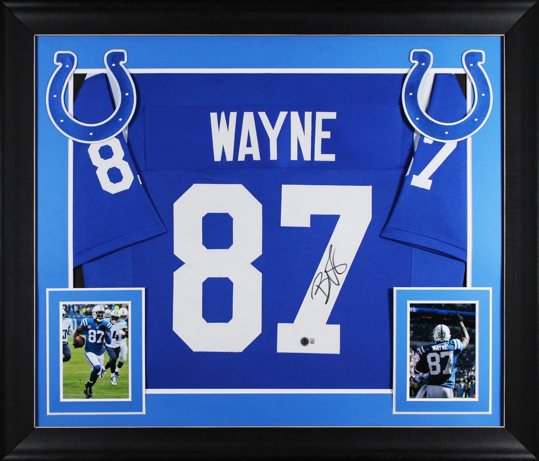 Framed Indianapolis Colts Reggie Wayne signed blue pro style jersey BAS witnessed: Framed Indianapolis Colts Reggie Wayne signed blue pro style jersey BAS witnessed This professionally framed blue Pro Style jersey has been personally signed by Reggie Wayne of the Indianapolis Colts.