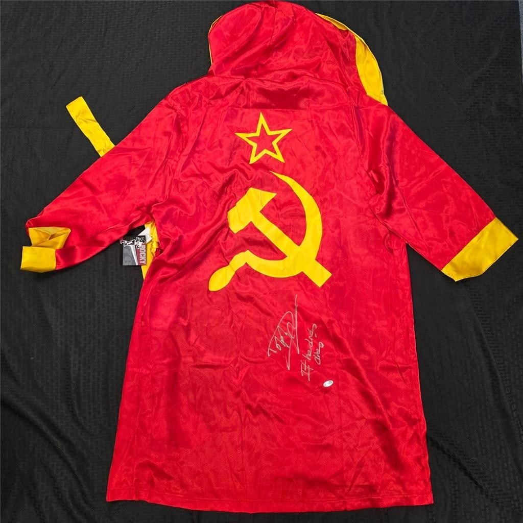 Dolph Lundgren Autographed Ivan Drago Rocky Robe With JSA Authentication: Dolph Lundgren Autographed Ivan Drago Rocky Robe With JSA Authentication This is an original Ivan Drago robe from the movie Rocky, signed by Dolph Lundgren with the inscription "If He Dies, He Dies!" 