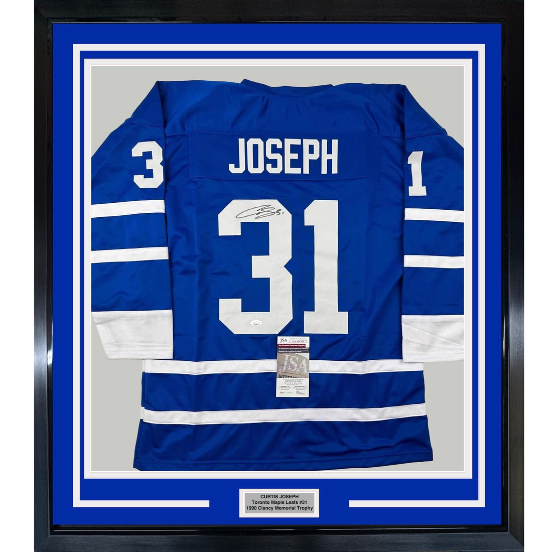 Framed Curtis Joseph Autographed NHL Jersey with JSA COA: Framed Curtis Joseph Autographed NHL Jersey with JSA COA Showcase your love for hockey with this professionally framed autographed Curtis Joseph Toronto Maple Leafs jersey. Measuring 35 inches by 39 i