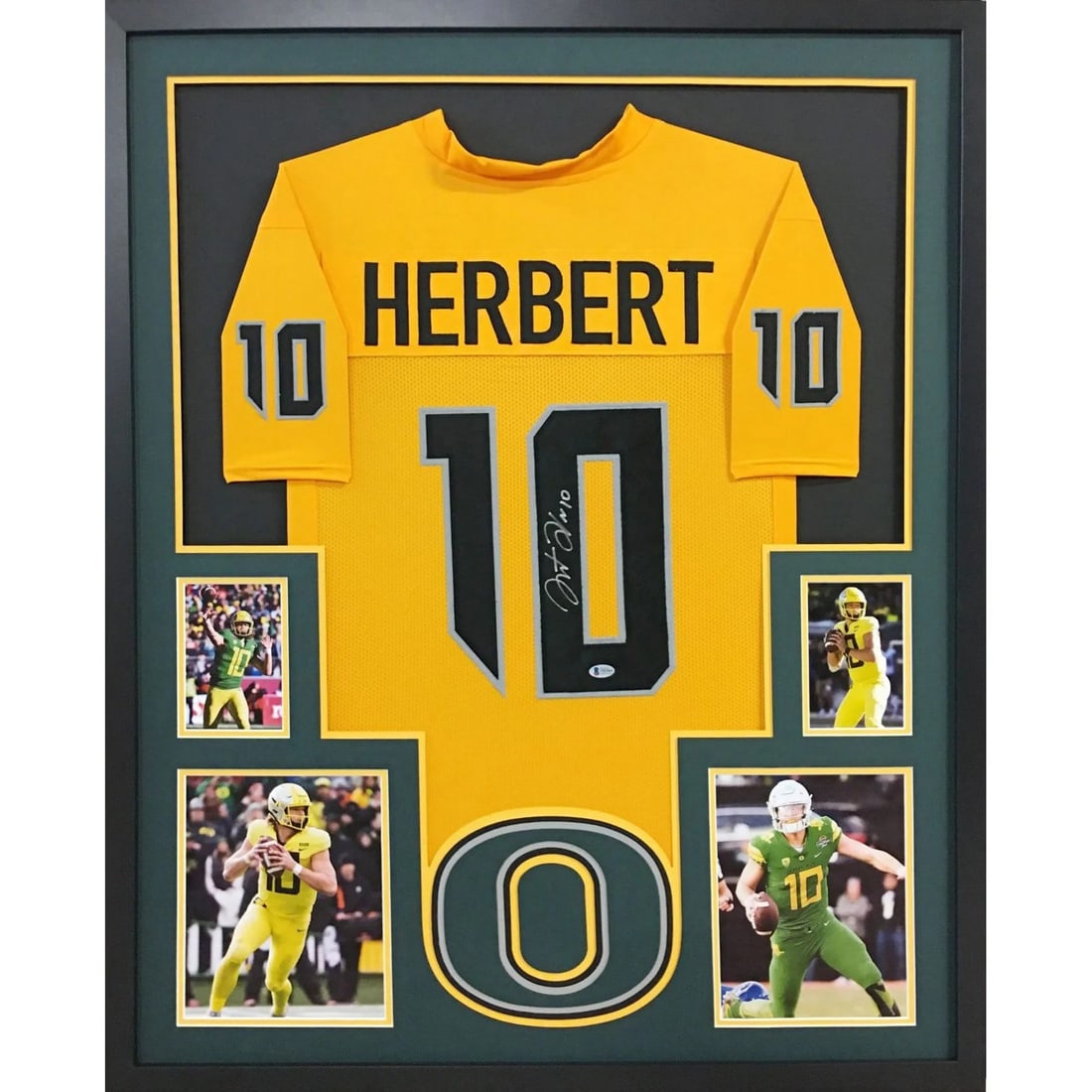 Framed Oregon Ducks Jersey Signed by Justin Herbert with Beckett Authentication: Framed Oregon Ducks Jersey Signed by Justin Herbert with Beckett Authentication This framed yellow Oregon Ducks jersey features an authentic autograph by Justin Herbert. The signature is verified by B