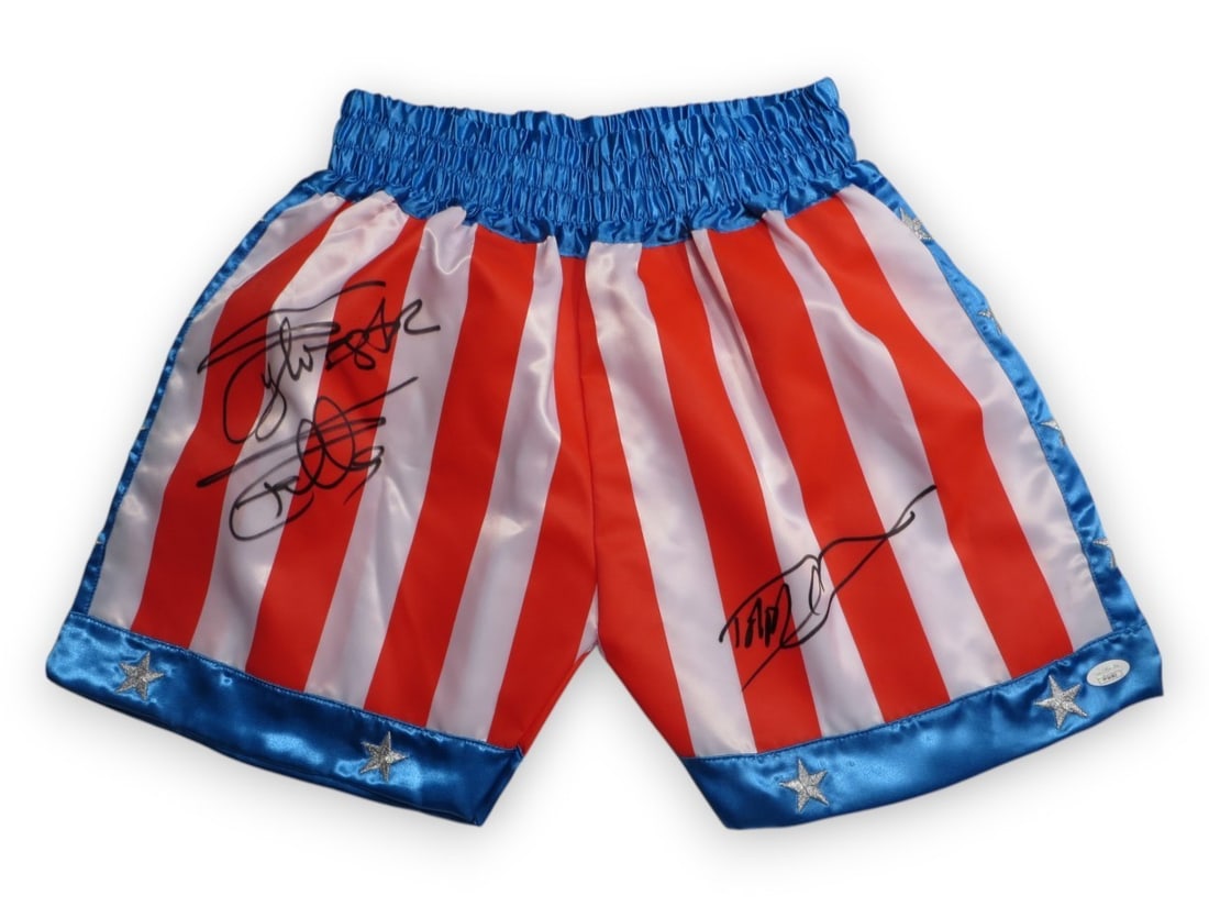 Sylvester Stallone Dolph Lundgren Signed Rocky IV Trunks JSA Certified: Sylvester Stallone Dolph Lundgren Signed Rocky IV Trunks JSA Certified Own a piece of cinematic history with these autographed trunks from the iconic film, Rocky IV. Signed by both Sylvester Stallone 