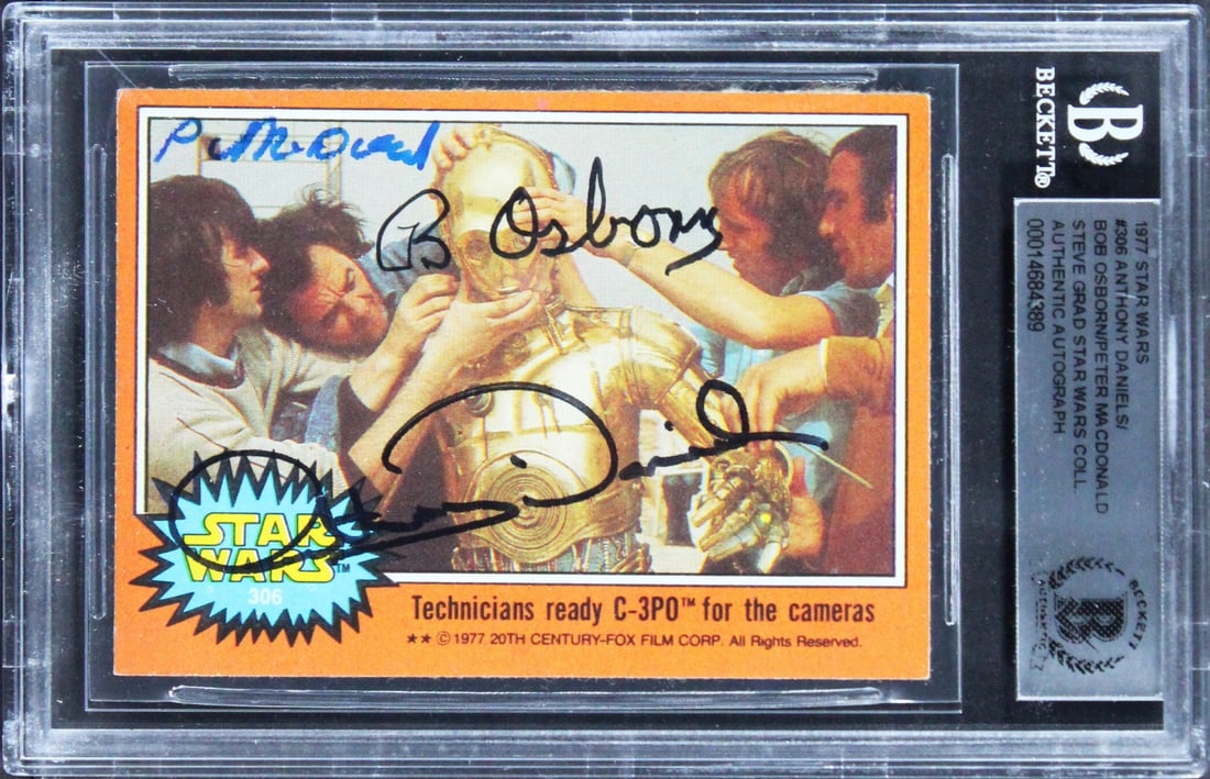 Star Wars 1977 Card Signed by Daniels Osborn MacDonald Beckett Authenticated Slab: Star Wars 1977 Card Signed by Daniels Osborn MacDonald Beckett Authenticated Slab This is an original 1977 Star Wars #75 trading card, personally signed by Anthony Daniels, Bob Osborn, and Peter MacDo