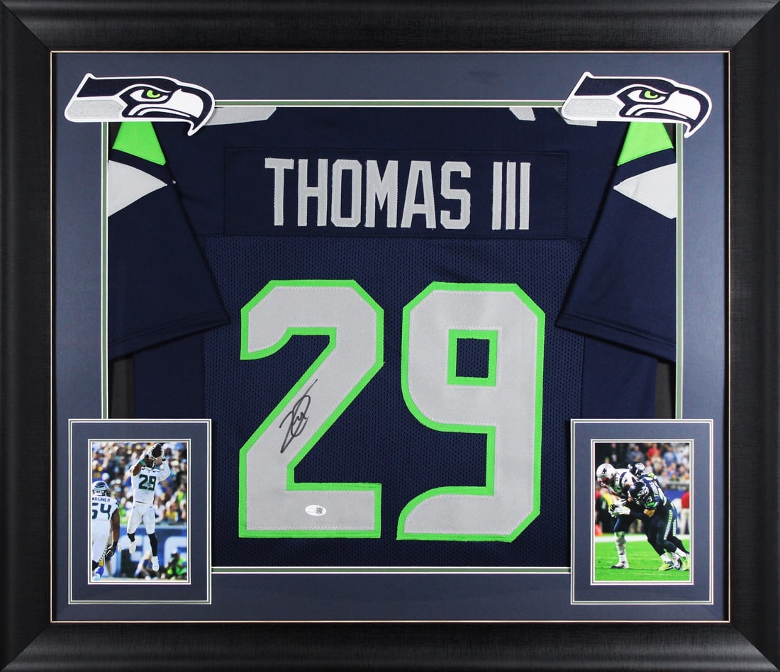 Framed Navy Jersey Signed by Earl Thomas JSA Witness Seahawks: Framed Navy Jersey Signed by Earl Thomas JSA Witness Seahawks This autographed navy pro style framed jersey has been personally signed by Earl Thomas of the Seattle Seahawks. It is an original item wi