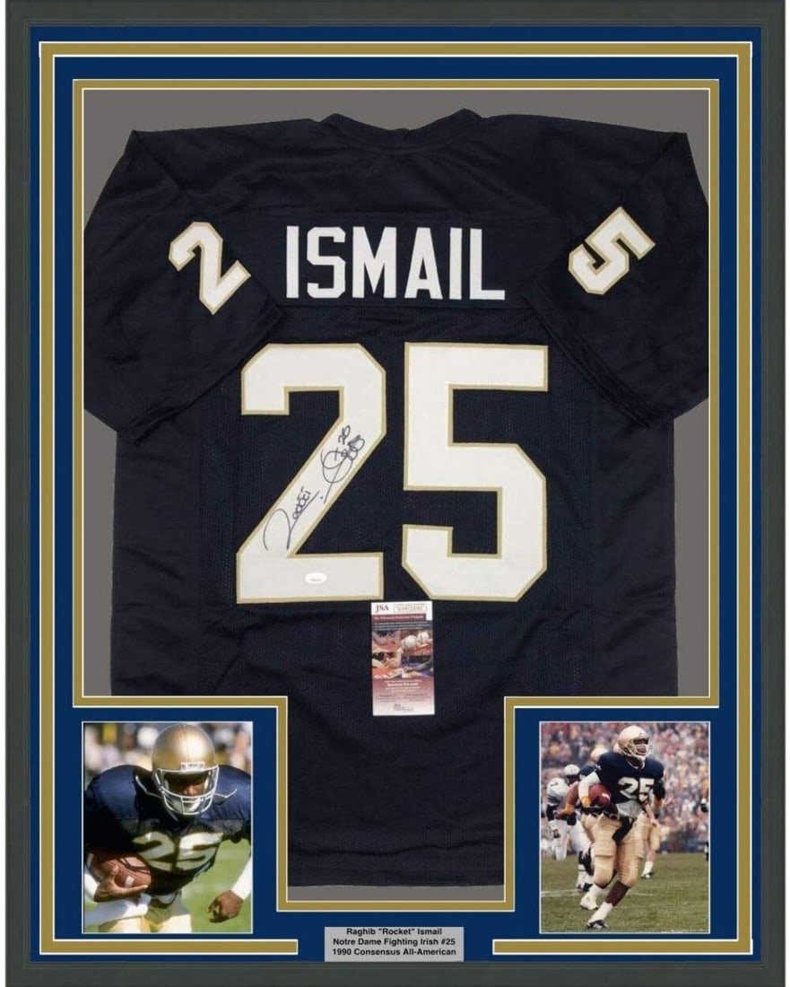 Raghib Ismail signed Notre Dame framed jersey 35x39 JSA COA: Raghib Ismail signed Notre Dame framed jersey 35x39 JSA COA This framed display features a Notre Dame Fighting Irish jersey autographed by Raghib Ismail, also known as "Rocket." The jersey is professi