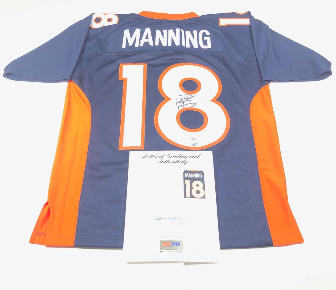 Peyton Manning Autographed Broncos Jersey PSA DNA Auto 10 Fanatics Sticker: Peyton Manning Autographed Broncos Jersey PSA DNA Auto 10 Fanatics Sticker This is an original football jersey signed by Peyton Manning, renowned for his career with the Colts and Broncos. The autogra
