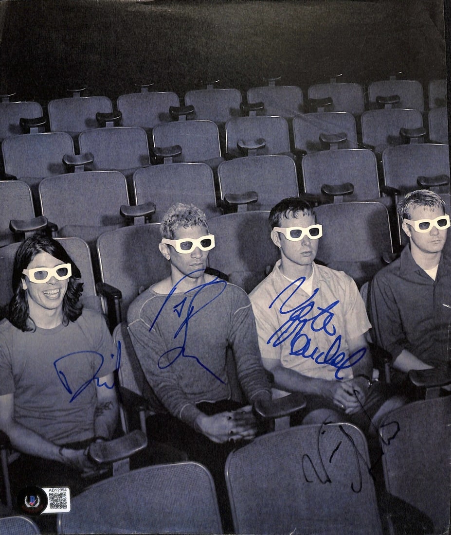Foo Fighters Vintage Signed Magazine Photo with Beckett LOA: Foo Fighters Vintage Signed Magazine Photo with Beckett LOA This vintage magazine photo features the original lineup of the iconic band Foo Fighters, showcasing autographs from all four members: David