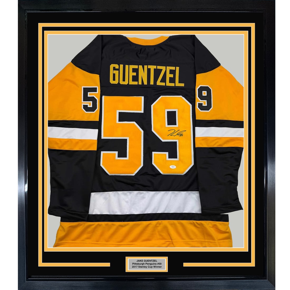 Framed Signed Jake Guentzel Jersey 35x39 Pittsburgh Penguins PSA COA: Framed Signed Jake Guentzel Jersey 35x39 Pittsburgh Penguins PSA COA Showcase your passion for hockey with this stunning framed autographed Jake Guentzel Pittsburgh Penguins jersey. This original item