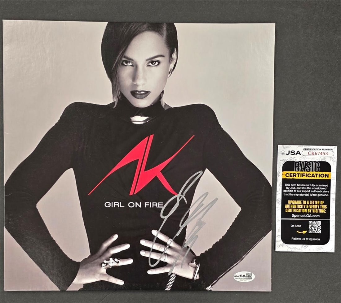 Alicia Keys autographed Girl on Fire LP cover JSA: Alicia Keys autographed Girl on Fire LP cover JSA This is an original 'Girl on Fire' vinyl record album cover signed by Alicia Keys. The autograph has been authenticated by James Spence Authentication