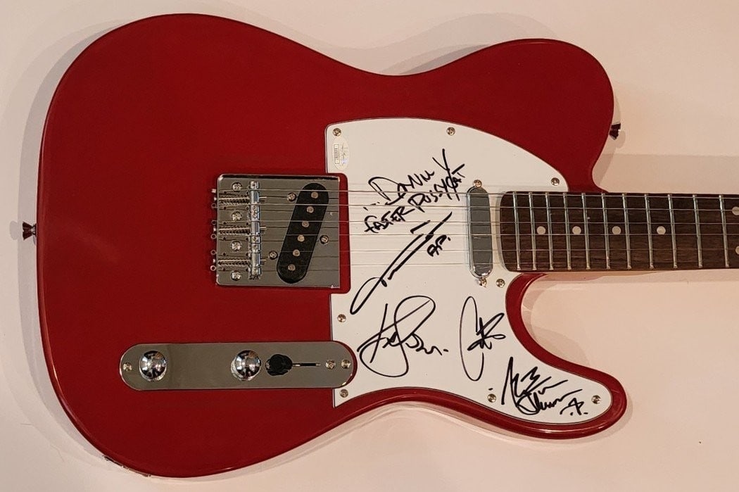 Faster Pussycat Autographed Electric Guitar with 5 Signatures JSA: Faster Pussycat Autographed Electric Guitar with 5 Signatures JSA This original autographed electric guitar from the Faster Pussycat band features signatures from notable members including Taime Downe
