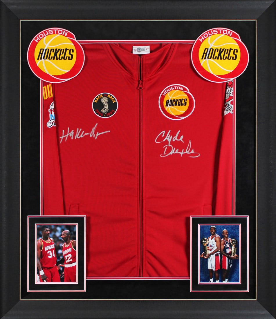 Hakeem Olajuwon Clyde Drexler Signed Houston Rockets Framed Jacket BAS: Hakeem Olajuwon Clyde Drexler Signed Houston Rockets Framed Jacket BAS Celebrate the legacy of the Houston Rockets with this stunning autographed red Mitchell & Ness bomber jacket, personally signed b