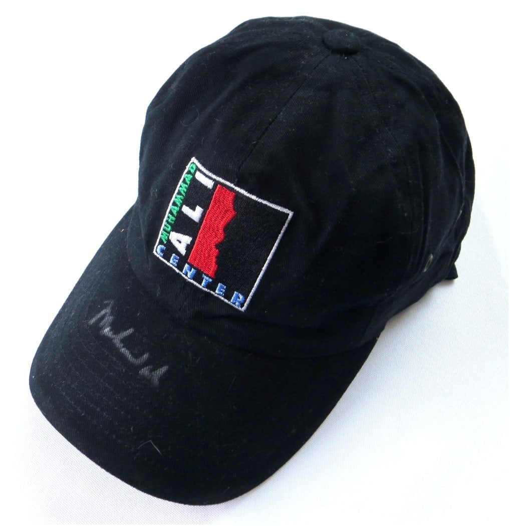 Muhammad Ali Autographed Baseball Hat Black Silver Ink JSA Certified: Muhammad Ali Autographed Baseball Hat Black Silver Ink JSA Certified This is an authentic baseball hat signed by the legendary boxer Muhammad Ali. The hat features a sleek black design with a striking