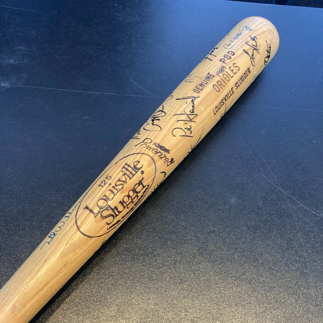 1989 Orioles Team Signed 34" Louisville Slugger Bat Featuring Cal Ripken Jr: 1989 Orioles Team Signed 34" Louisville Slugger Bat Featuring Cal Ripken Jr This is an original 34-inch Louisville Slugger P89 "ORIOLES" professional stock baseball bat, game-issued for the 1989 Balti