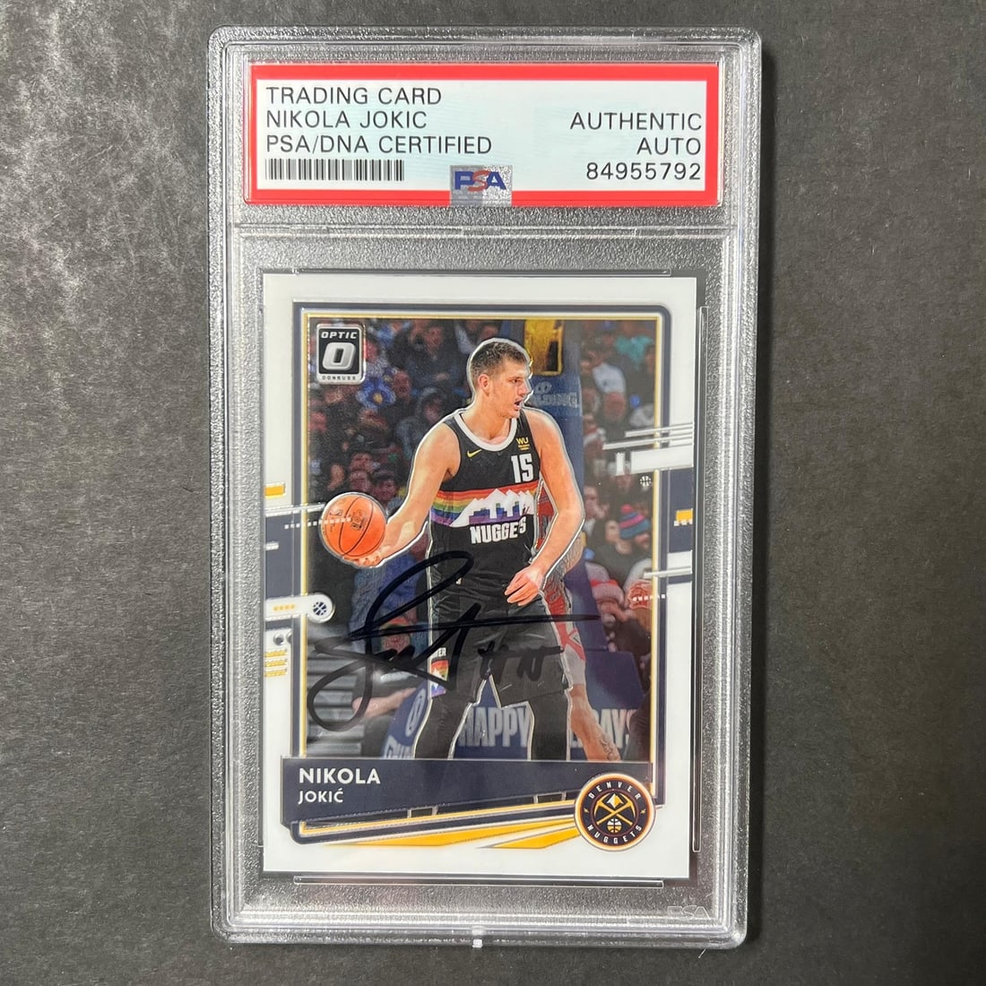 Nikola Jokic PSA Slabbed Autographed Donruss Optic 96 Nuggets Card: Nikola Jokic PSA Slabbed Autographed Donruss Optic 96 Nuggets Card This is a 2020-21 Panini Donruss Optic #96 sports trading card featuring Nikola Jokic of the Denver Nuggets. The card has been person