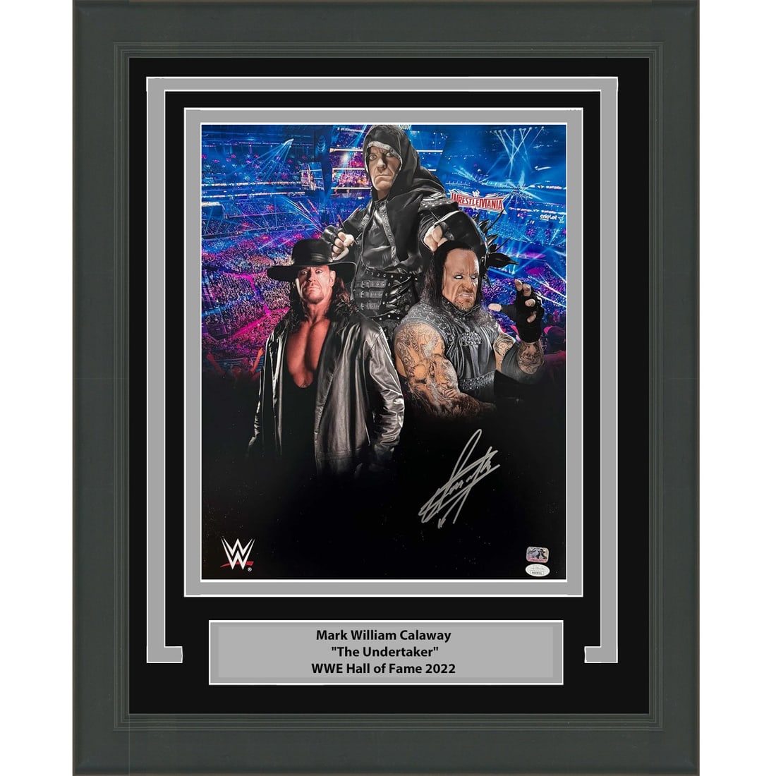 Framed Signed WWE 16x20 Photo of The Undertaker JSA Authenticated: Framed Signed WWE 16x20 Photo of The Undertaker JSA Authenticated This professionally framed and matted 16x20 photo features the legendary wrestler Mark Calaway, known as The Undertaker. The piece is 