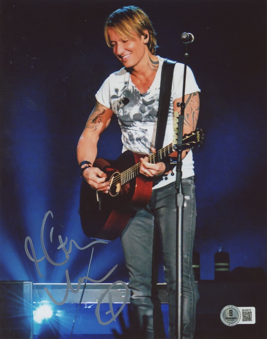 Keith Urban Autographed 8x10 Photo with Beckett Authentication: Keith Urban Autographed 8x10 Photo with Beckett Authentication This authentic vertical 8x10 photograph features the signature of country music star Keith Urban. The photograph comes with a Beckett Aut