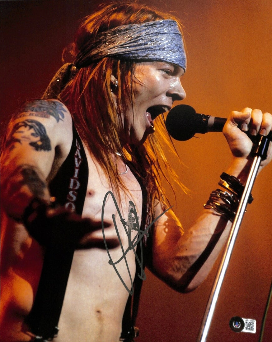 11x14 Color Photo Hand Signed by AXL Rose with Beckett LOA: 11x14 Color Photo Hand Signed by AXL Rose with Beckett LOA This 11x14 color photograph features an authentic signature by AXL Rose, the iconic lead singer of Guns N' Roses. Signed with a silver paint 