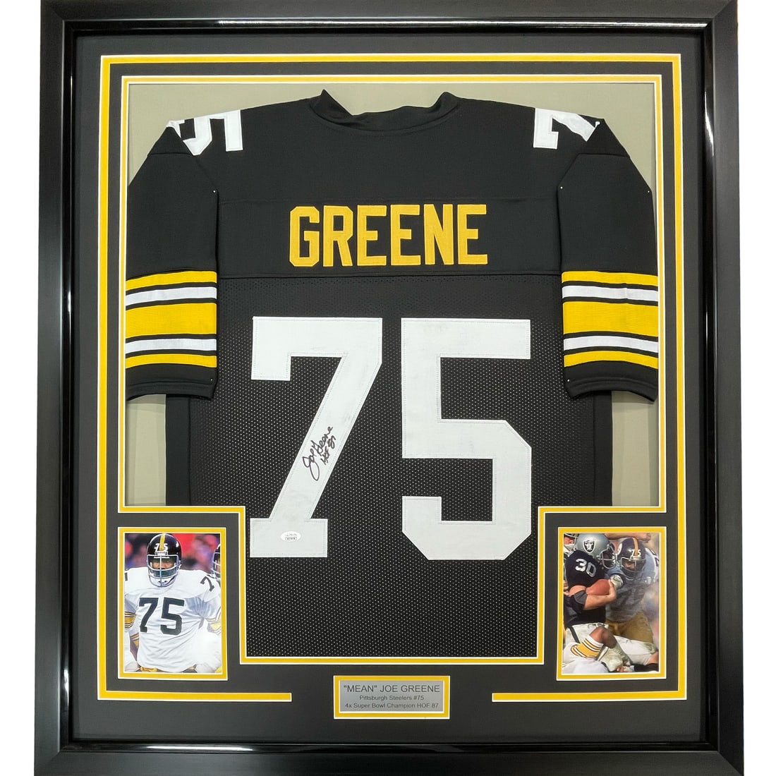 Mean Joe Greene Framed Steelers Jersey JSA COA 35x39: Mean Joe Greene Framed Steelers Jersey JSA COA 35x39 This is a professionally framed and matted Pittsburgh Steelers black jersey autographed by Mean Joe Greene. The display includes two 5x7 photograph