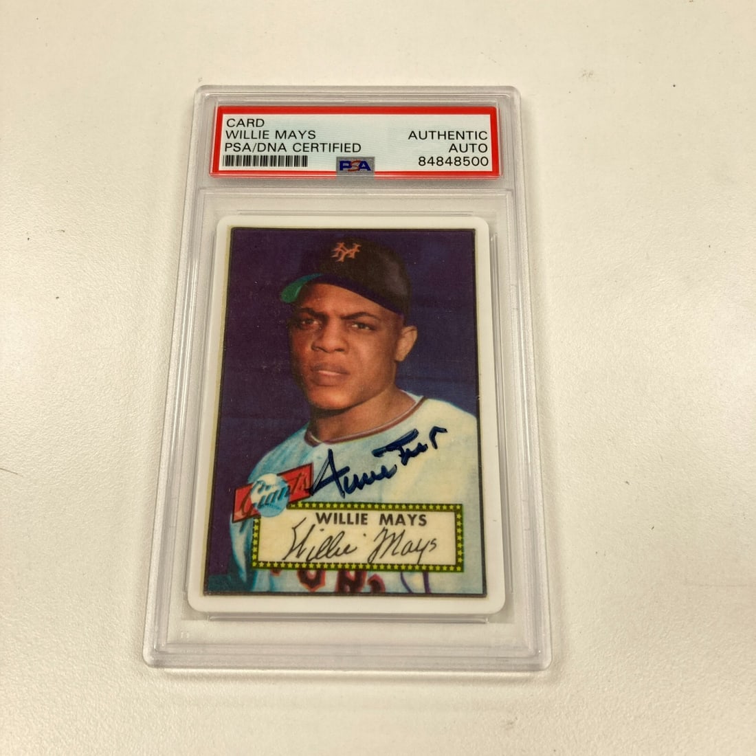 1952 Topps Willie Mays Rookie Card Autographed PSA DNA: 1952 Topps Willie Mays Rookie Card Autographed PSA DNA This remarkable 1952 Topps Willie Mays RC is a signed porcelain baseball card that showcases the legendary player in stunning detail. Authenticat