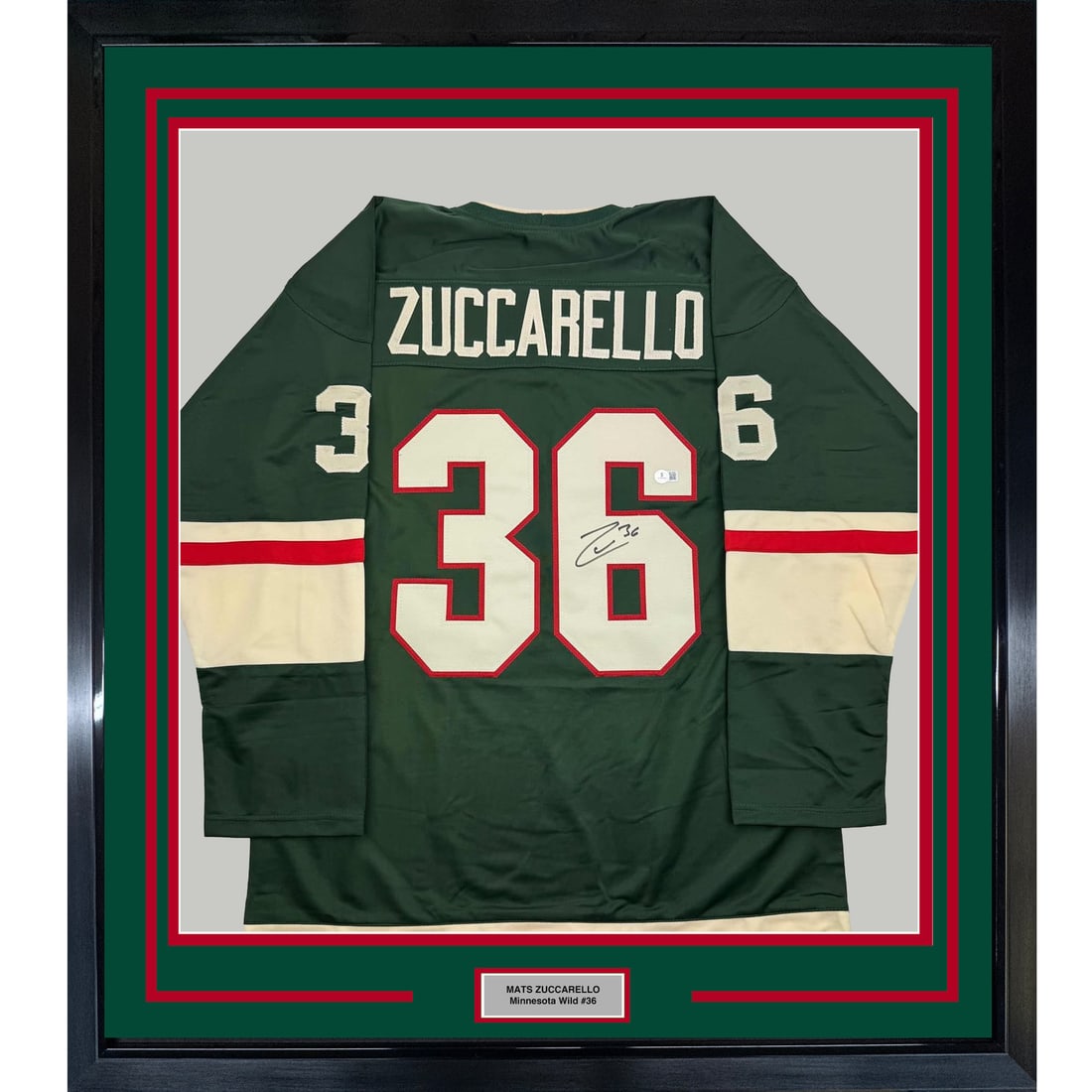 Mats Zuccarello Signed Minnesota Wild Framed Jersey Beckett COA 35x39: Mats Zuccarello Signed Minnesota Wild Framed Jersey Beckett COA 35x39 This is a professionally framed and matted Minnesota Wild green jersey autographed by Mats Zuccarello. The display includes two 5x