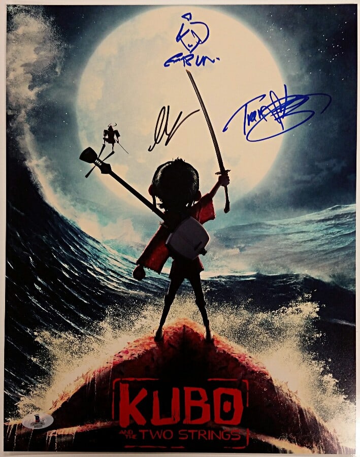 11x14 Autographed Kubo and the Two Strings Photo Three Cast Signatures BAS COA: 11x14 Autographed Kubo and the Two Strings Photo Three Cast Signatures BAS COA This 11x14 photo from KUBO and the TWO STRINGS is hand-signed by three cast members: Art Parkinson, Charlize Theron, and 