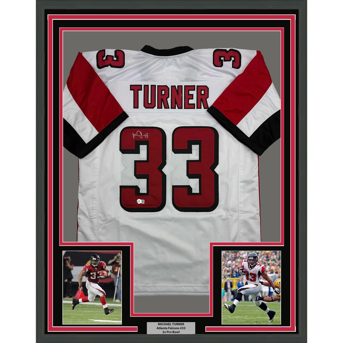Michael Turner Signed Atlanta Falcons Jersey in 35x39 Frame with Beckett Authentication: Michael Turner Signed Atlanta Falcons Jersey in 35x39 Frame with Beckett Authentication This is a professionally framed and matted Atlanta Falcons white jersey autographed by Michael Turner. The displ