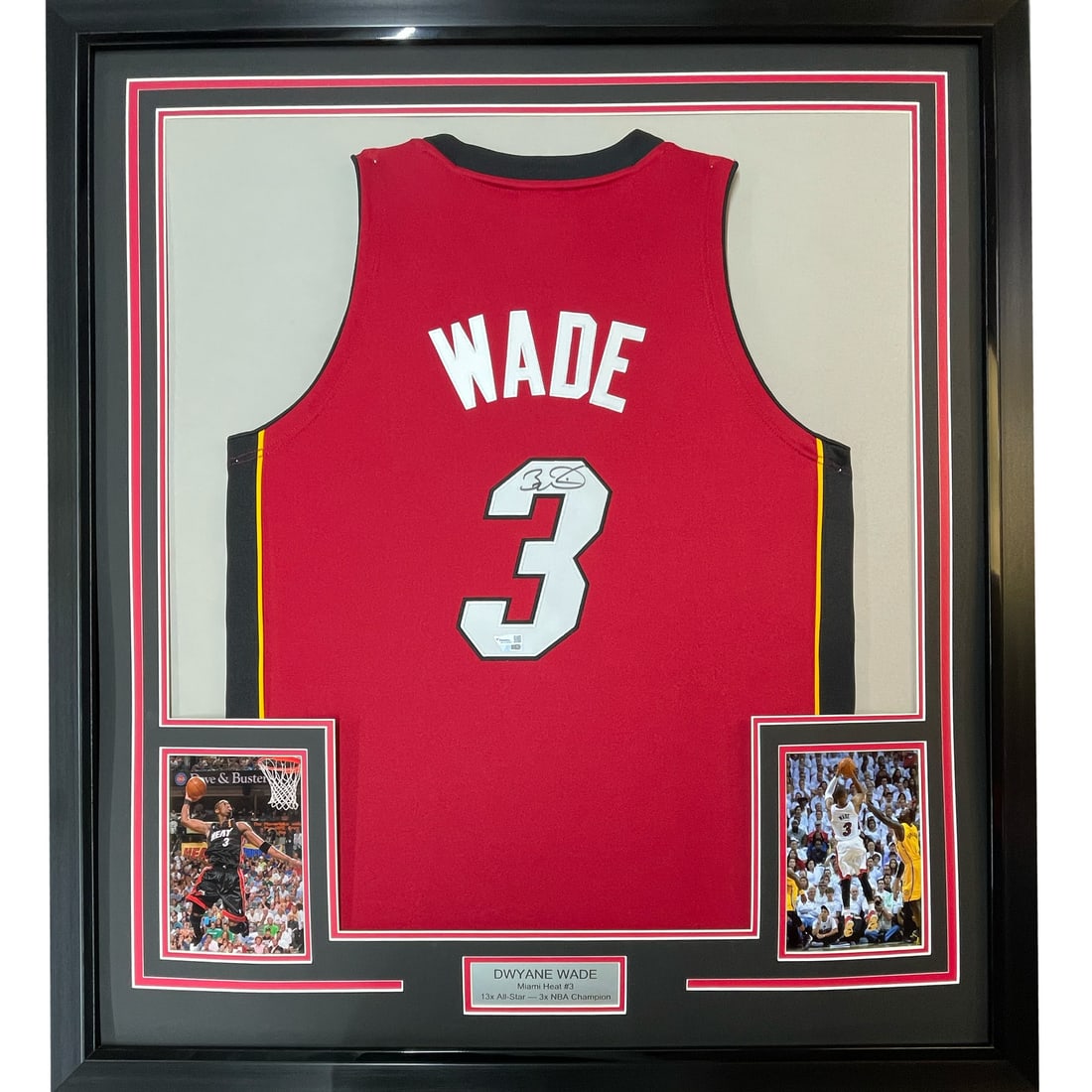 Framed Autographed Dwyane Wade Miami Heat Jersey with Fanatics COA: Framed Autographed Dwyane Wade Miami Heat Jersey with Fanatics COA This is a professionally framed and matted autographed Dwyane Wade jersey, featuring a striking red design. It includes two 5x7 photo