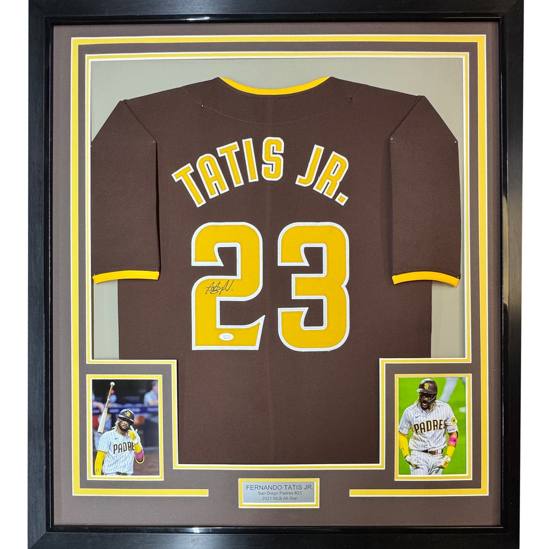 Framed Signed Fernando Tatis Jr. Jersey with JSA COA 33x42: Framed Signed Fernando Tatis Jr. Jersey with JSA COA 33x42 This is a professionally framed and matted autographed jersey of Fernando Tatis Jr., featuring the striking brown color associated with the S