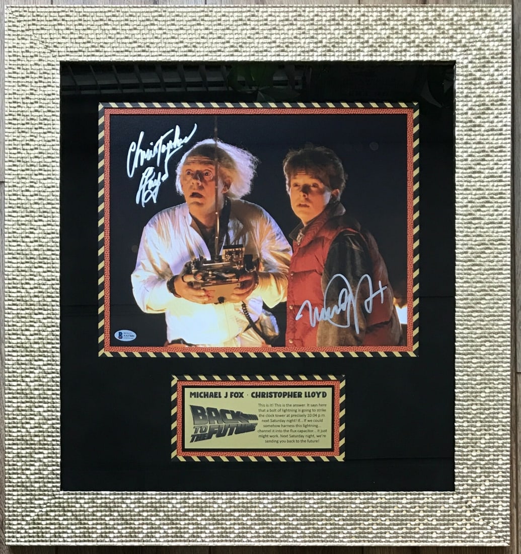 Michael J Fox Christopher Lloyd Signed Back to the Future 11x14 Photo Framed Beckett Authenticated: Michael J Fox Christopher Lloyd Signed Back to the Future 11x14 Photo Framed Beckett Authenticated This stunning display features a professionally framed 11x14 photograph signed by the iconic actors M