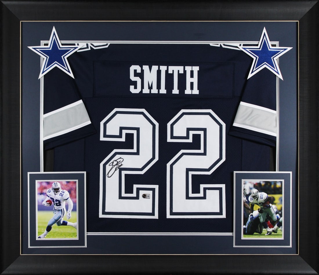 Framed Emmitt Smith Signed Navy Jersey Beckett BAS Witnessed: Framed Emmitt Smith Signed Navy Jersey Beckett BAS Witnessed This autographed navy pro style framed jersey has been personally signed by Emmitt Smith of the Dallas Cowboys. It is an original item with