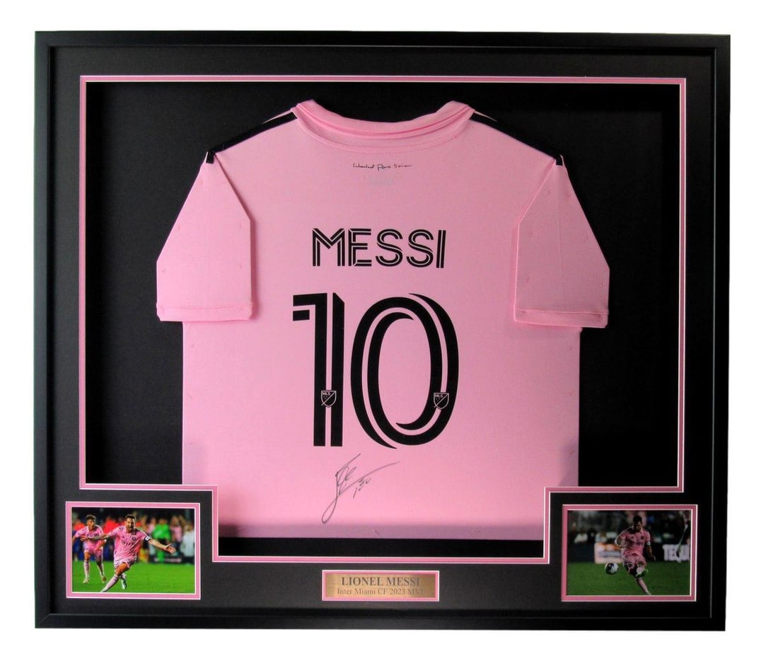 Framed Inter Miami CF Pink Soccer Jersey Signed by Lionel Messi 36 in x 42 in: Framed Inter Miami CF Pink Soccer Jersey Signed by Lionel Messi 36 in x 42 in This framed Inter Miami CF pink soccer jersey is signed by Lionel Messi. The jersey is professionally presented in a displ