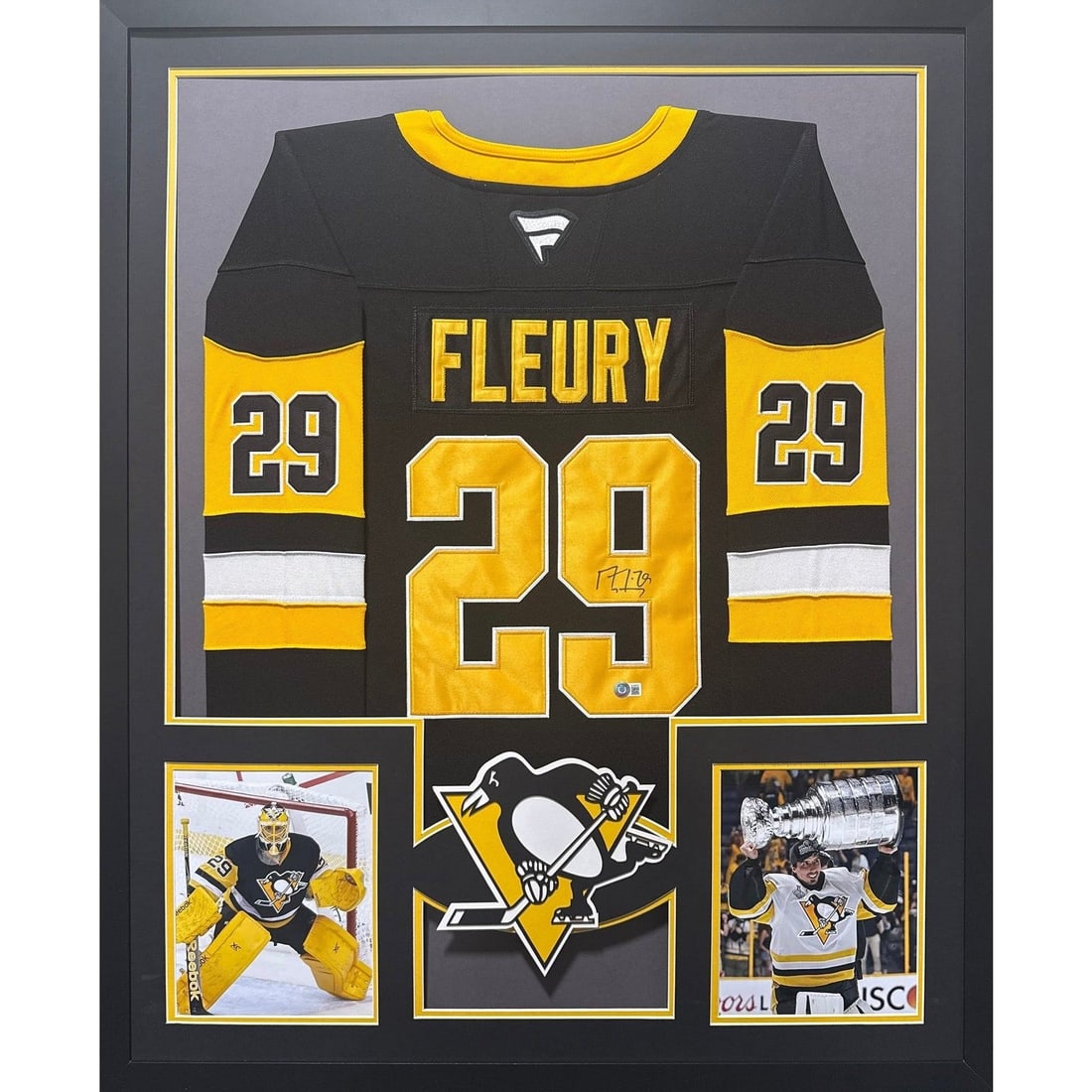 Framed Pittsburgh Penguins Marc-Andre Fleury Jersey Signed With Beckett Authentication: Framed Pittsburgh Penguins Marc-Andre Fleury Jersey Signed With Beckett Authentication This framed jersey features an authentic signature from Marc-Andre Fleury and is presented in a display highlight