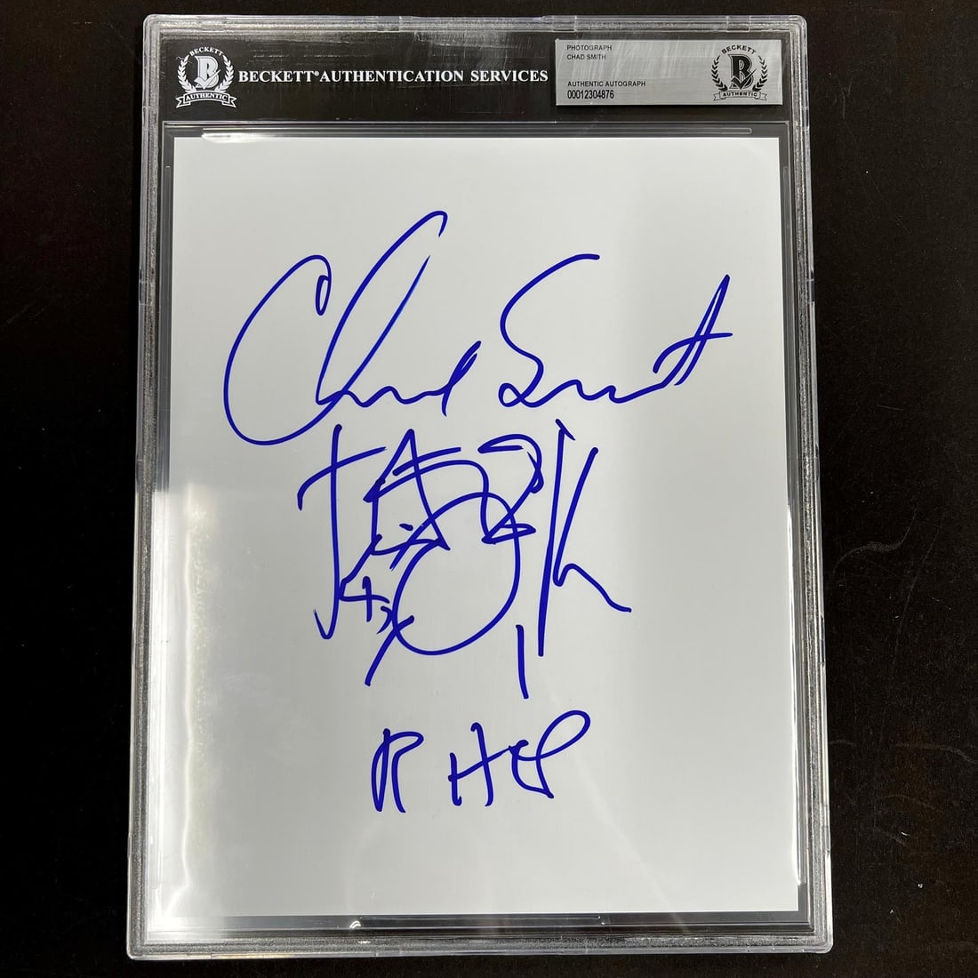 Chad Smith Autographed 8x10 Photo Beckett Encapsulated: Chad Smith Autographed 8x10 Photo Beckett Encapsulated This 8x10 autographed page features the signature of Chad Smith, expertly authenticated and encapsulated by Beckett. The encapsulation guarantees