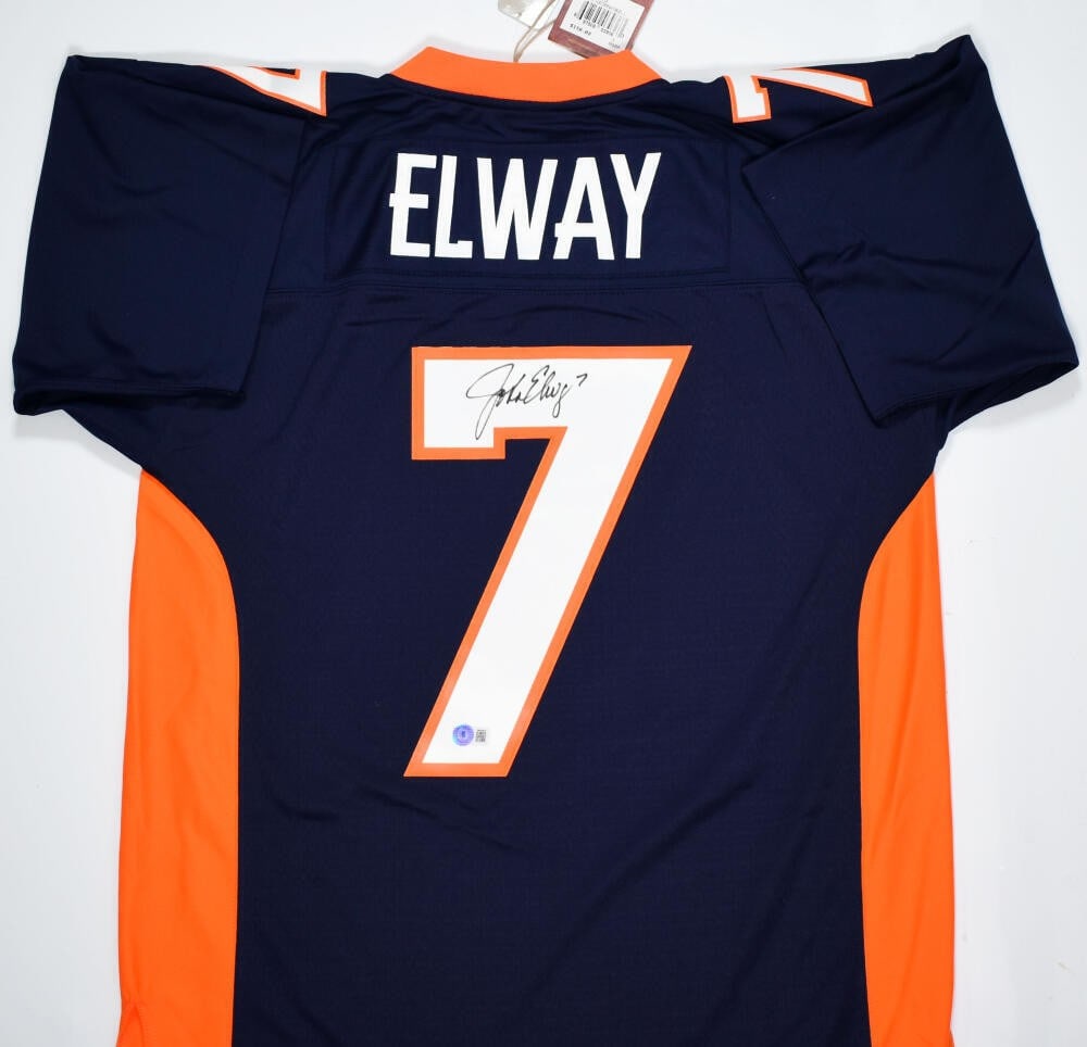 Mitchell Ness 1998 Legacy Broncos Jersey signed by John Elway BAS: Mitchell Ness 1998 Legacy Broncos Jersey signed by John Elway BAS This is an original John Elway signed Denver Broncos football jersey from Mitchell & Ness. It is a blue 1998 Legacy jersey and is list