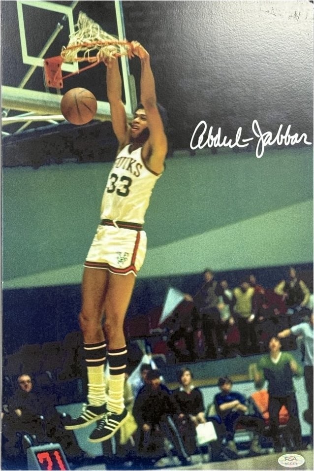 12x18 Matted Photo Signed by Kareem Abdul-Jabbar PSA Authenticated Lakers: 12x18 Matted Photo Signed by Kareem Abdul-Jabbar PSA Authenticated Lakers This is an original 12x18 matted photo autographed by Kareem Abdul-Jabbar, featuring his time with the Los Angeles Lakers. The