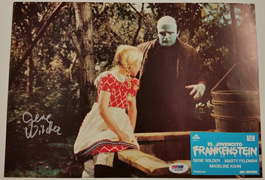 Young Frankenstein Lobby Card Signed by Gene Wilder with PSA DNA Authentication: Young Frankenstein Lobby Card Signed by Gene Wilder with PSA DNA Authentication This is an original 9.5 x 13 inch lobby card from the film Young Frankenstein, personally signed by Gene Wilder. Authent