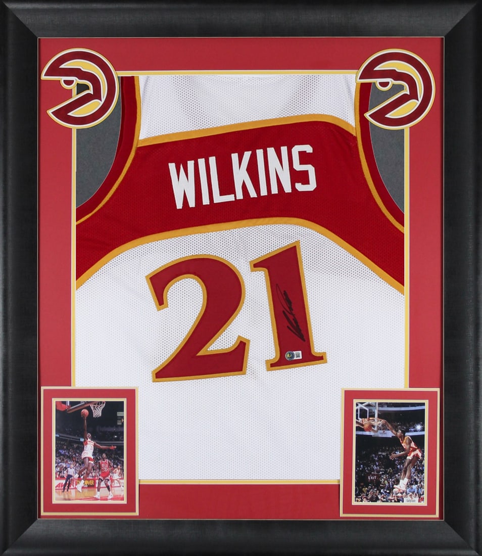 Framed White Jersey Signed by Dominique Wilkins BAS Witness Atlanta Hawks: Framed White Jersey Signed by Dominique Wilkins BAS Witness Atlanta Hawks This professionally framed white pro style jersey features the authentic hand-signed signature of Dominique Wilkins of the Atl