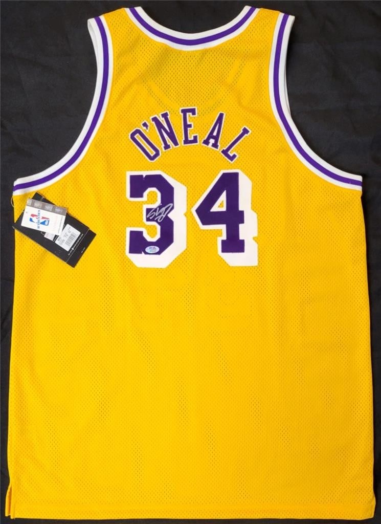 Shaquille O'Neal Signed Nike Lakers Jersey PSA Authenticated: Shaquille O'Neal Signed Nike Lakers Jersey PSA Authenticated This authentic Los Angeles Lakers jersey is signed by the legendary Shaquille O'Neal, a must-have for any basketball fan or collector. The 