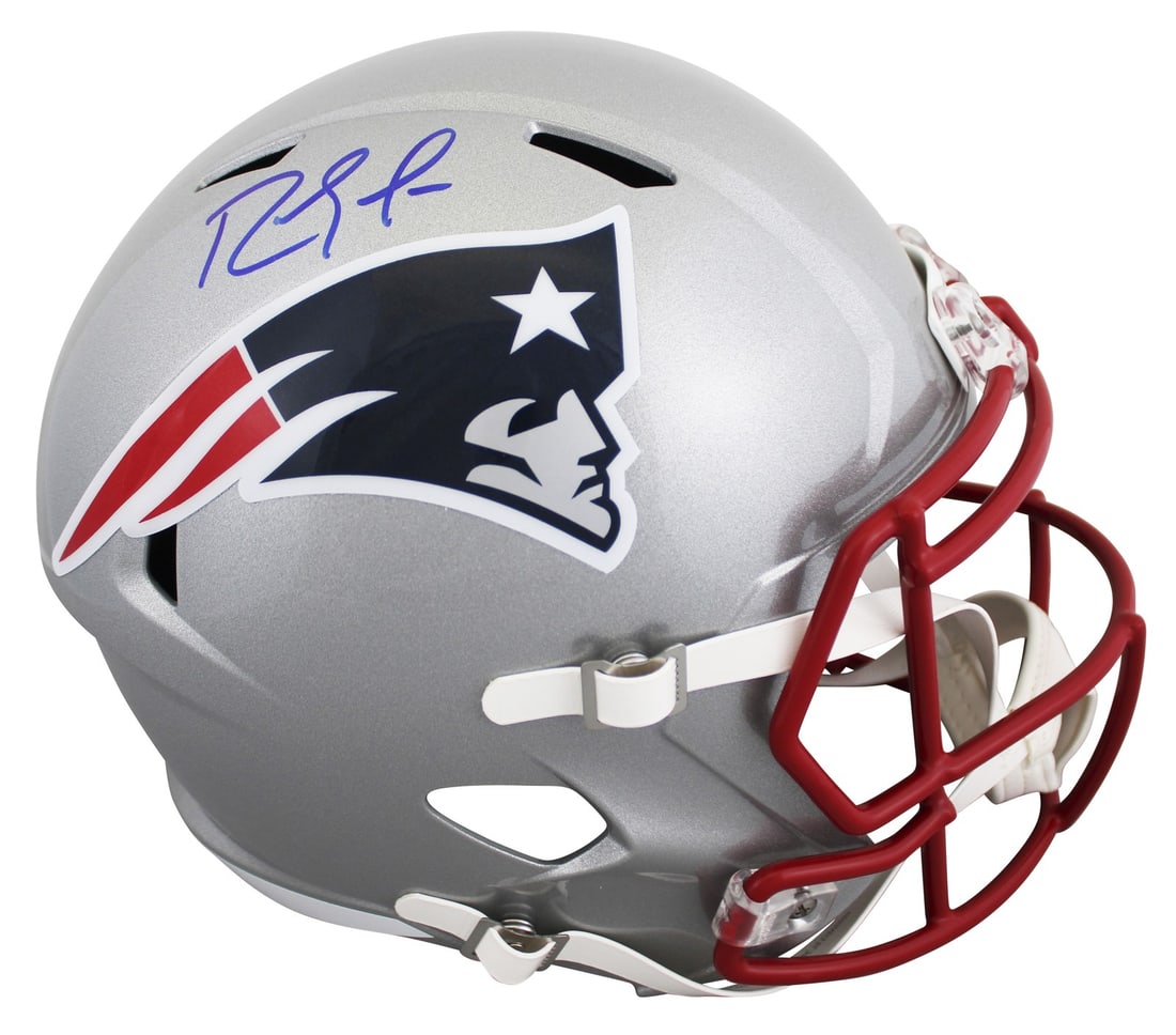 Randy Moss signed Patriots Riddell Speed replica helmet BAS witnessed: Randy Moss signed Patriots Riddell Speed replica helmet BAS witnessed This Riddell full-size Speed replica helmet features an authentic signature from Randy Moss of the New England Patriots. The helme