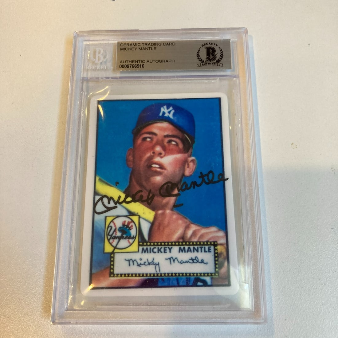 1952 Topps Mickey Mantle Signed Rookie Baseball Card Beckett Certified: 1952 Topps Mickey Mantle Signed Rookie Baseball Card Beckett Certified This 1952 Topps Mickey Mantle signed porcelain baseball card is a remarkable piece for any sports trading card collector. As a ro