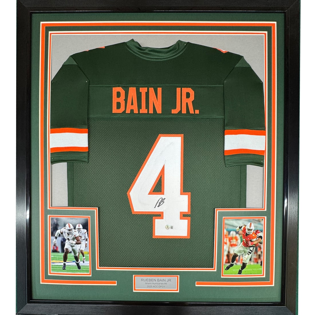 Rueben Bain Jr Signed Miami Hurricanes Jersey 35x39 Framed Beckett Authenticated: Rueben Bain Jr Signed Miami Hurricanes Jersey 35x39 Framed Beckett Authenticated This professionally framed and matted display features an autographed Miami Hurricanes green jersey signed by Rueben Ba