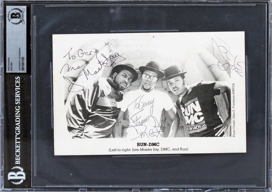 Run DMC Signed Photo 5.5x8.5 Authenticated by Beckett: Run DMC Signed Photo 5.5x8.5 Authenticated by Beckett This is an authentic signed 5.5x8.5 photo featuring Jam Master Jay, DMC, and Run from the iconic hip-hop group Run DMC. The photo has been persona