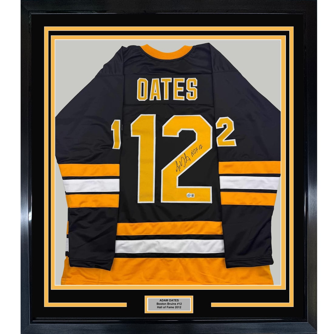 Framed Adam Oates Autographed Black Hockey Jersey with BAS COA 35x39: Framed Adam Oates Autographed Black Hockey Jersey with BAS COA 35x39 This framed and autographed Adam Oates black hockey jersey commemorates his Hall of Fame induction in 2012. Measuring 35x39 inches,