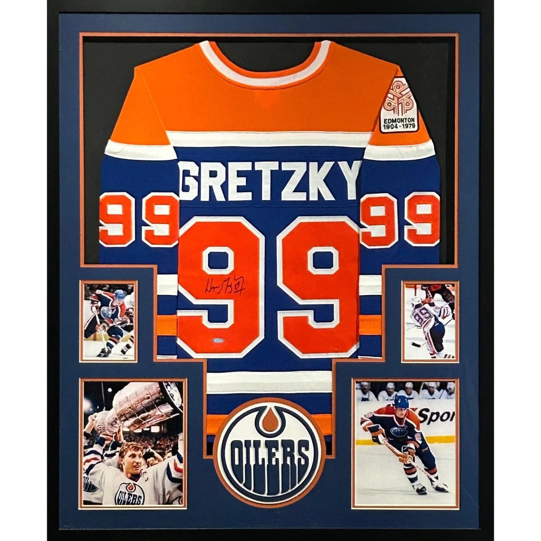 Framed Wayne Gretzky Autographed Oilers Blue Jersey UDA COA: Framed Wayne Gretzky Autographed Oilers Blue Jersey UDA COA This framed Edmonton Oilers blue jersey is autographed by Wayne Gretzky. The jersey is authenticated by Upper Deck (UDA) and includes a tamp