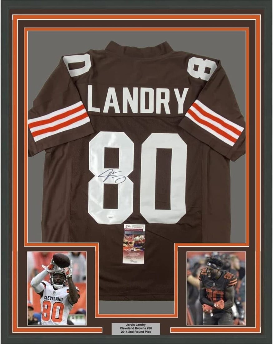 Jarvis Landry Signed Custom Browns Jersey Framed 33x42 JSA Authenticated: Jarvis Landry Signed Custom Browns Jersey Framed 33x42 JSA Authenticated This framed collectible features a custom football jersey autographed by Jarvis Landry, associated with the Cleveland Browns. T